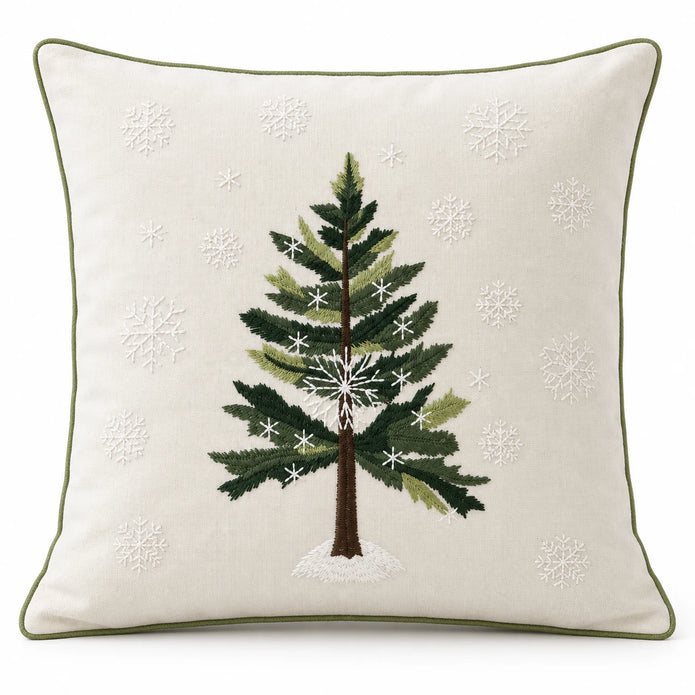 Front studio view of the green Christmas tree cushion cover with white snowflakes and olive green piping.