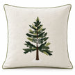 Front studio view of the green Christmas tree cushion cover with white snowflakes and olive green piping.