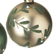 Close-up of champagne gold mistletoe bauble showing green leaf texture, gold stems and white pearl-like berries
