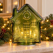 Green LED glass gingerbread house Christmas decoration with illumination, crafted by Candlelight Products Ltd for festive mantel displays.