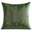 Front studio view of the green velvet cushion cover with three fine embroidered Christmas trees on a white background.
