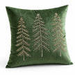 Angled studio view of the green velvet embroidered tree cushion cover showing its texture and tree design.