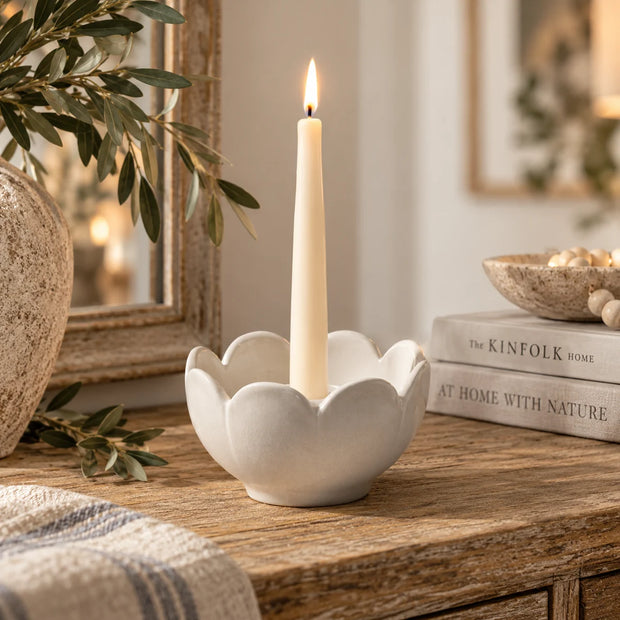 Grey ceramic flower candle holder by Wikholmform, decorative home decor piece with a floral design for tabletop display.