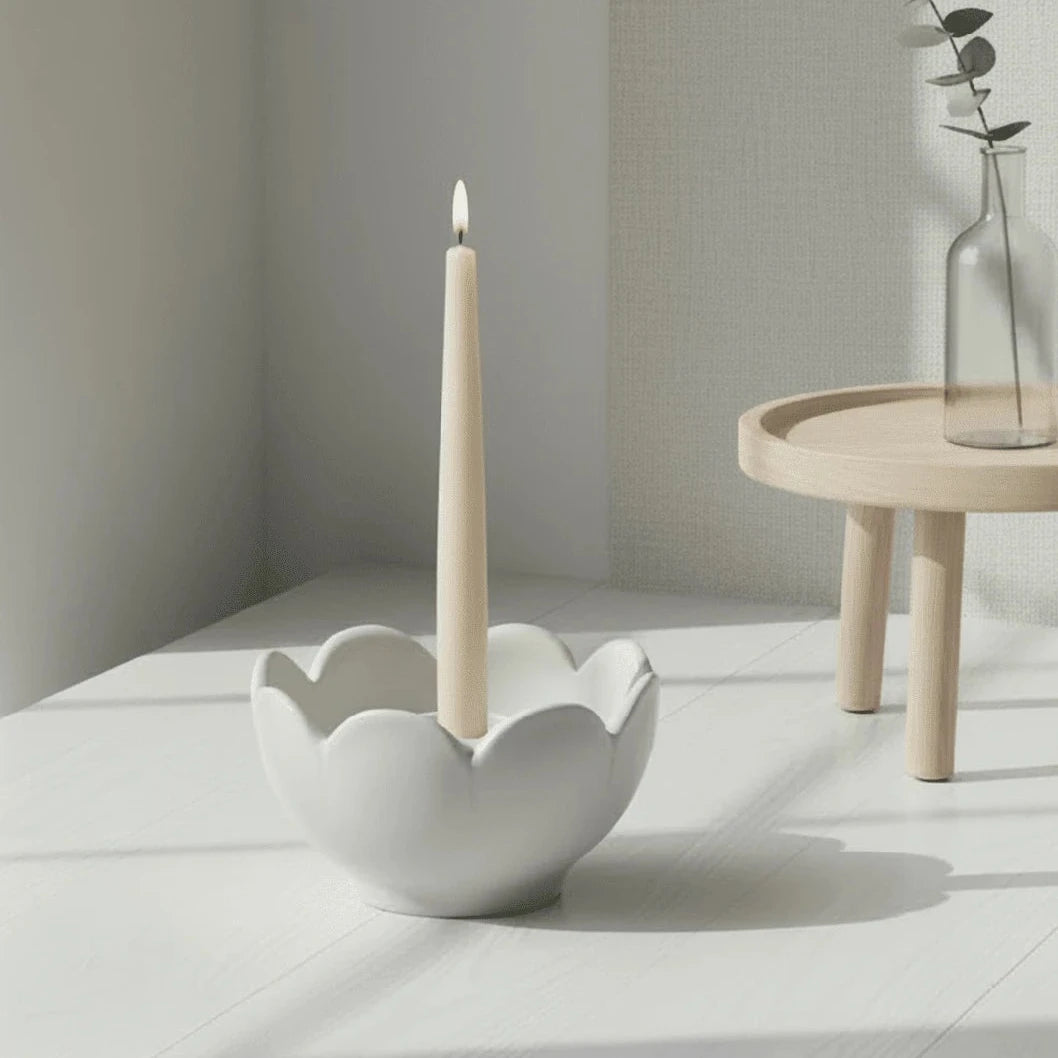 Grey ceramic flower candle holder by Wikholmform, designed for elegant home decor with a floral motif.