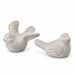 Set of two grey stone bird ornaments on white, one with raised wings and one with folded wings.