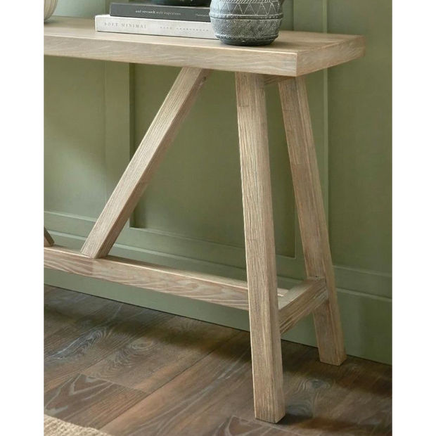 Wooden console table from Hill Interiors' Haldon Collection, showcasing a sleek, modern design perfect for entryways or living rooms.