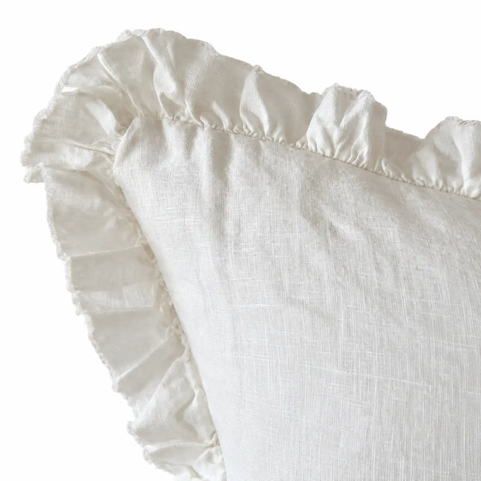 Hallie white cushion cover close-up showing the stonewashed linen texture and ruffled edge