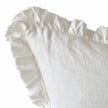 Hallie white cushion cover close-up showing the stonewashed linen texture and ruffled edge