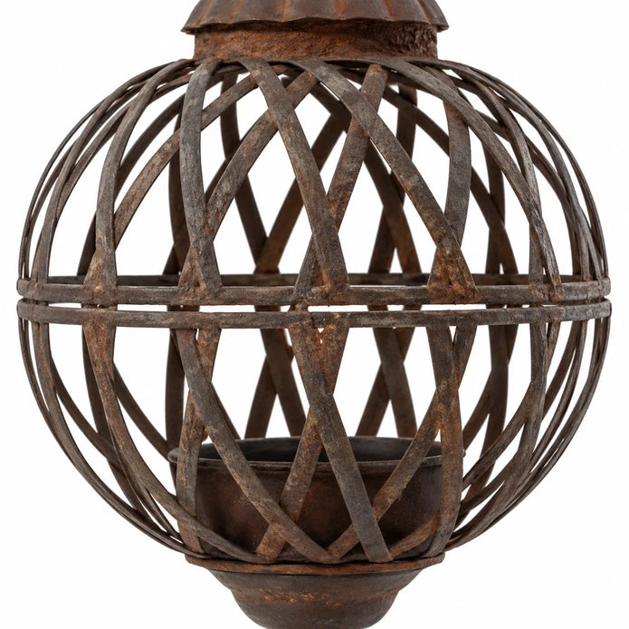 Close-up of the rusty lattice strips, central band and aged metal finish on the hanging ball planter.