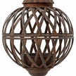 Close-up of the rusty lattice strips, central band and aged metal finish on the hanging ball planter.