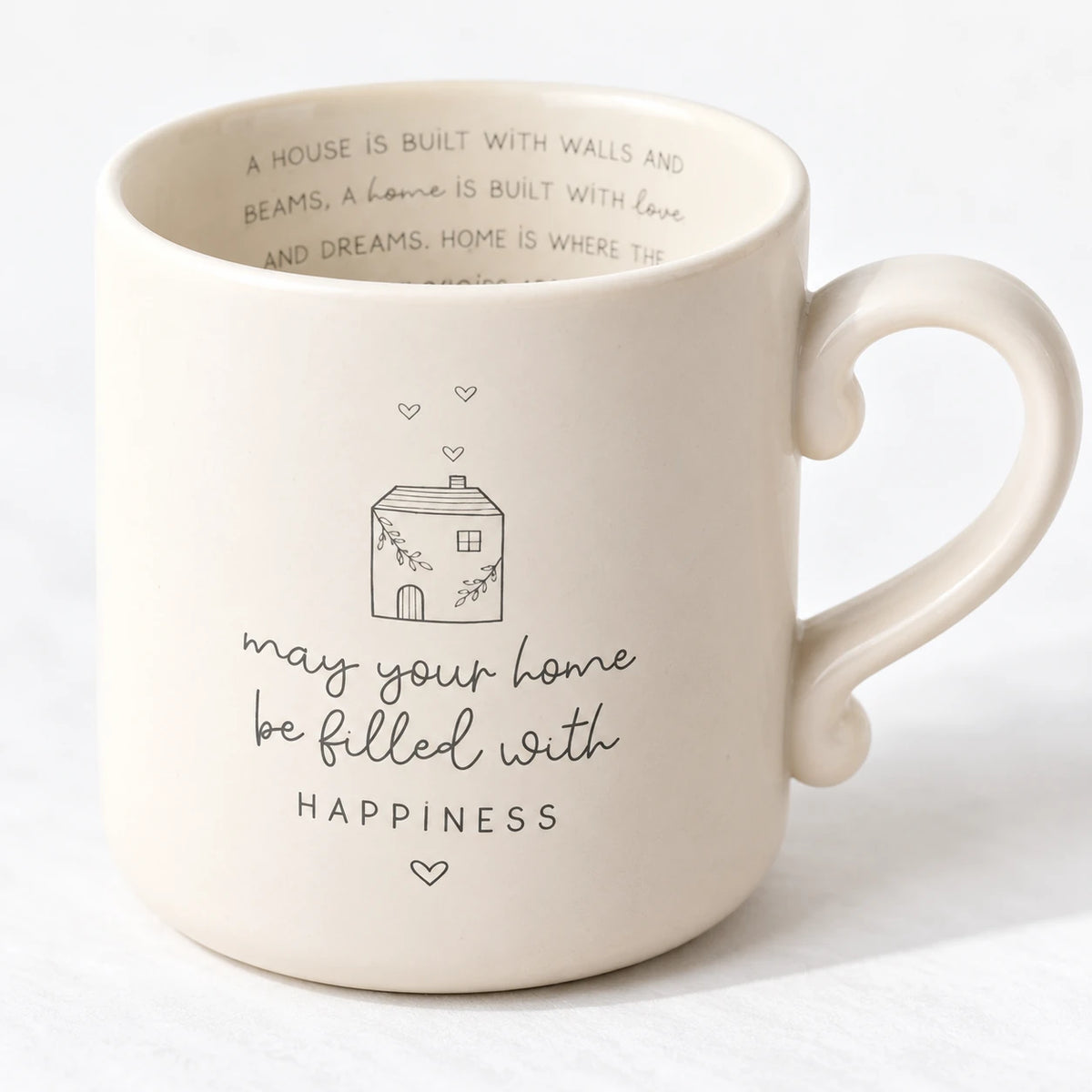 Widdop & Co Beige Moments Mug with Happy Home design, neutral ceramic coffee cup on a studio background