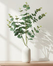 Large artificial eucalyptus bunch stem from Heaven Sends, featuring realistic green eucalyptus leaves on a natural-looking stem.