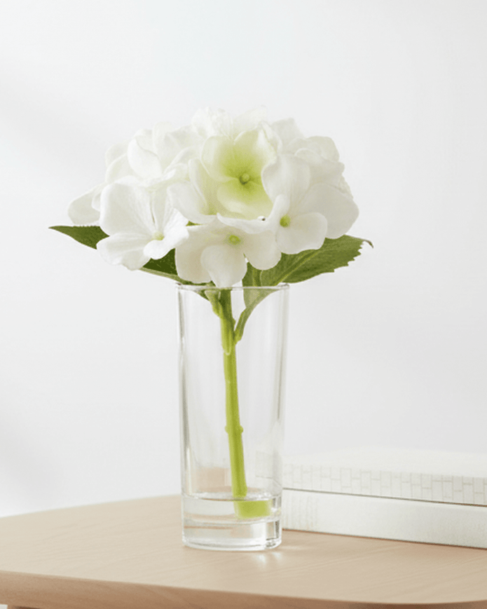 Artificial Mini White Hydrangea Stem In A Glass Bud Vase