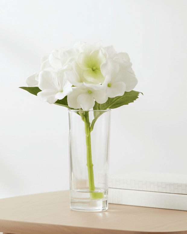 Artificial Mini White Hydrangea Stem In A Glass Bud Vase