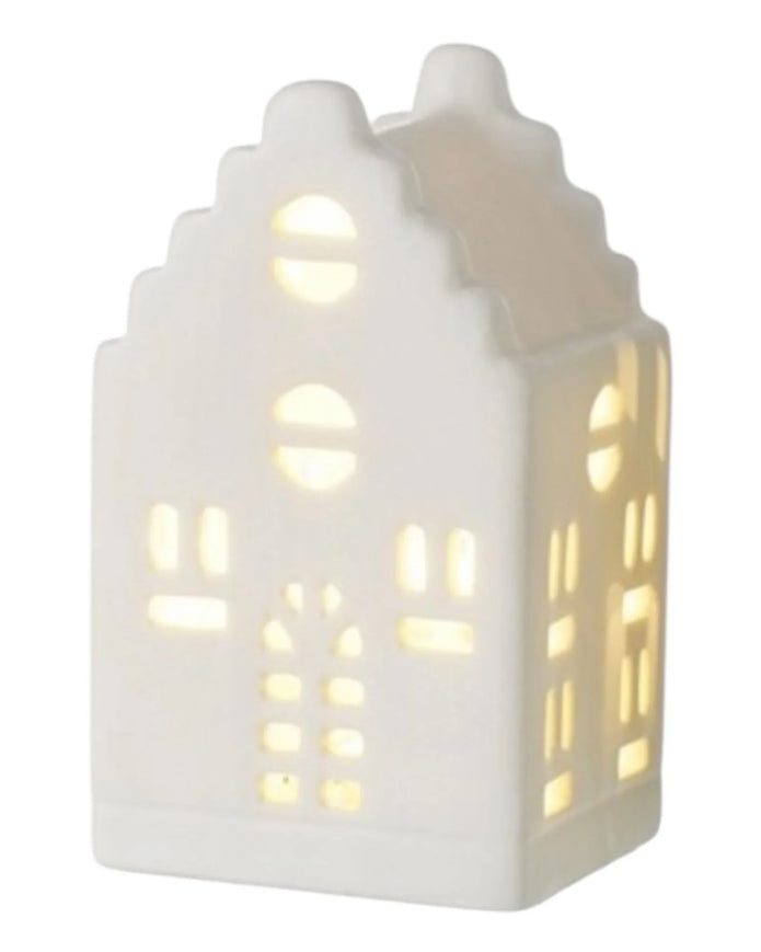 Beige ceramic Christmas house with LED lights, decorative holiday scene from Heaven Sends.