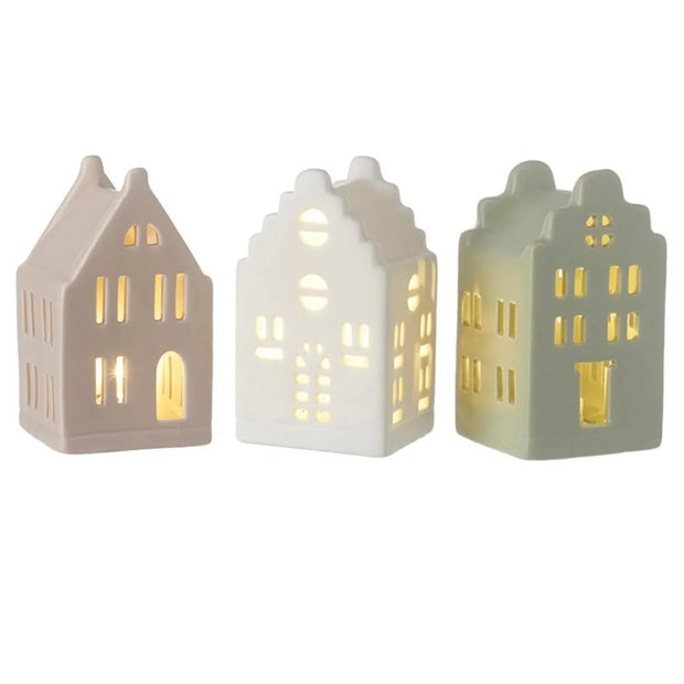 Heaven Sends Christmas beige LED light-up ceramic house with windows and chimney, festive holiday decoration.