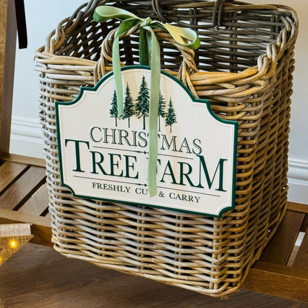 White and green Christmas Tree Farm sign by Heaven Sends featuring festive holiday lettering and seasonal decor.