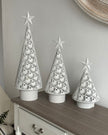 White metal cut-out Christmas LED light-up tree by Heaven Sends, featuring illuminated branches and festive holiday design.