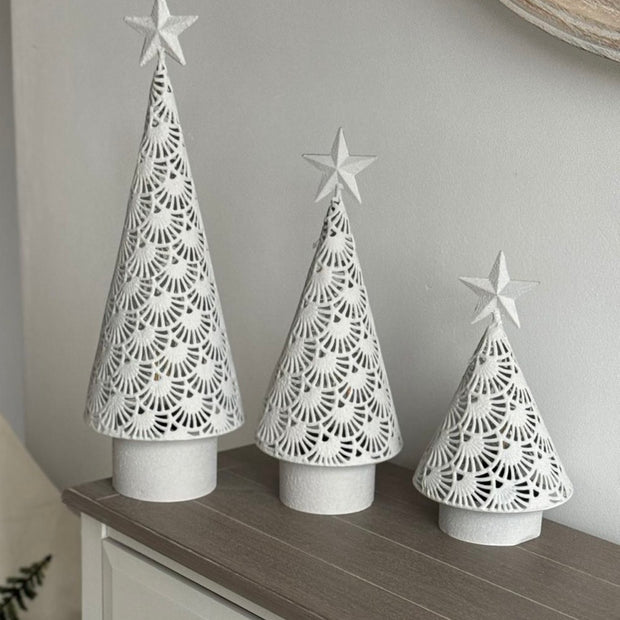 White metal cut-out Christmas LED light-up tree by Heaven Sends, featuring illuminated branches and festive holiday design.