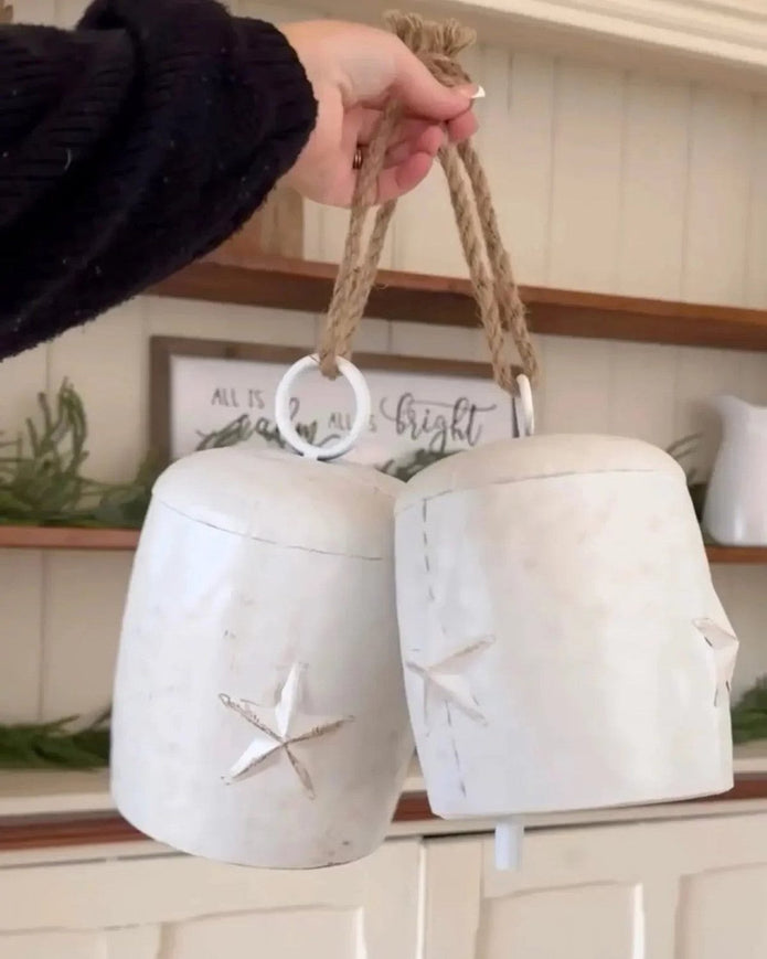 Neutral white Christmas cow bells with star decoration, from Heaven Sends, perfect for holiday decor and festive celebrations.