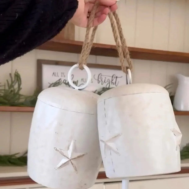 Neutral white Christmas cow bells with star decoration, from Heaven Sends, perfect for holiday decor and festive celebrations.