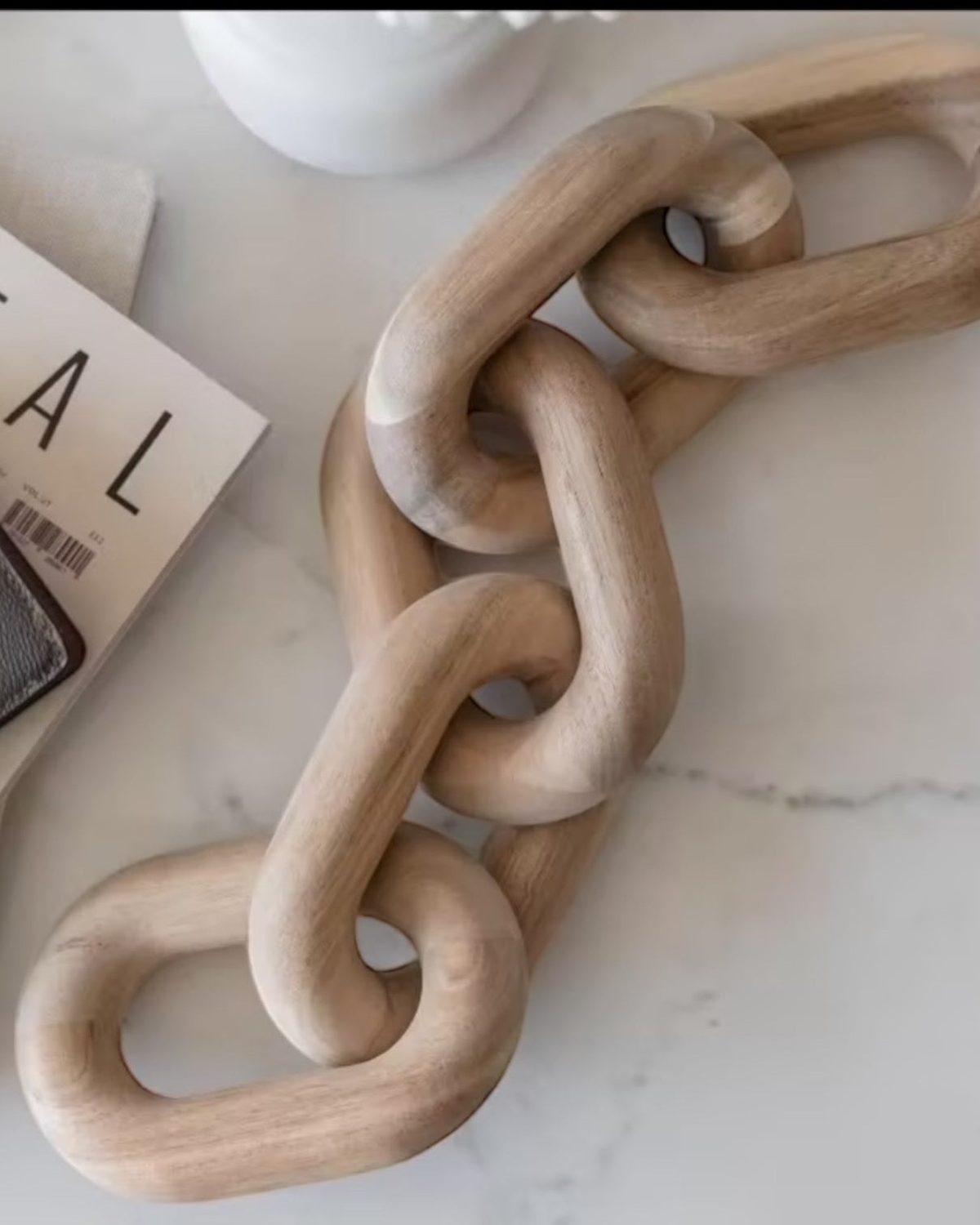 Natural wooden chain decor for home decoration, featuring interconnected wooden links, by Heaven Sends.