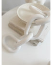 White wooden chain decor for home interior, featuring interconnected wooden links, designed by Heaven Sends.