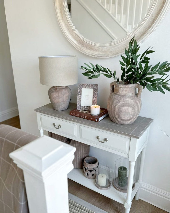 Interior by Premier Heritage two-drawer neutral console table with artificial green fennel foliage for stylish home decor.