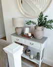 Interior by Premier Heritage two-drawer neutral console table with artificial green fennel foliage for stylish home decor.