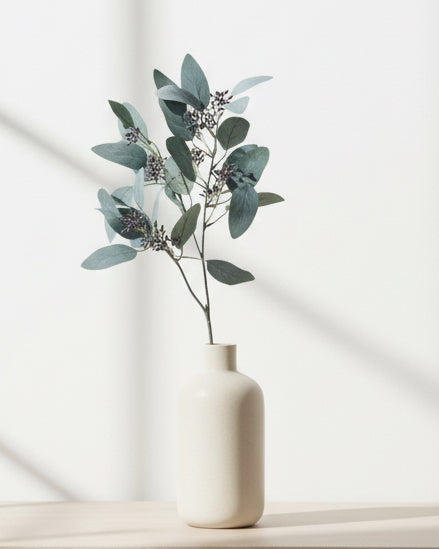Artificial Seaded Eucalyptus Stem from Hill Interiors, realistic green eucalyptus leaves on a tall artificial plant stem.