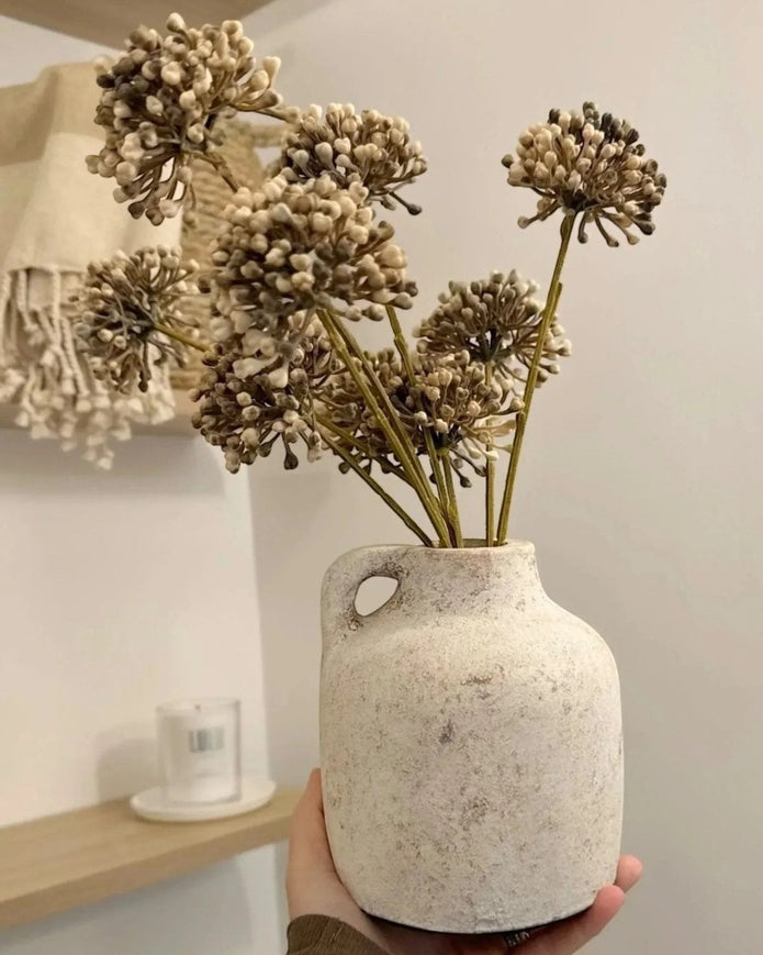 Artificial brown Allium stem from Hill Interiors, showcasing realistic faux plant with brown floral blooms and green stems.