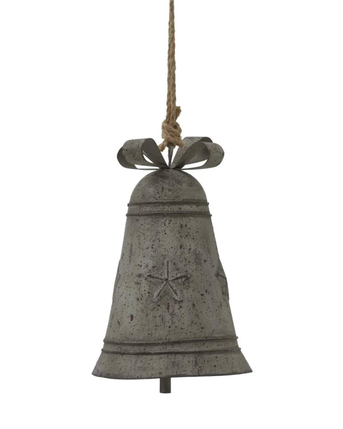 Rustic metal hanging Christmas bell with a decorative bow, perfect for holiday decor from Hill Interiors.
