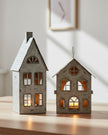 Rustic metal tealight candle house for Christmas decor by Hill Interiors, featuring a cozy, festive design with candle opening.