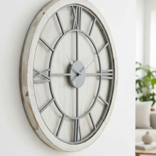 White medium round wooden Williston wall clock by Hill Interiors, showing a minimalist design with black hour and minute hands.