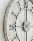 White medium round wooden Williston wall clock by Hill Interiors showing a classic clock face with black numerals and hands.