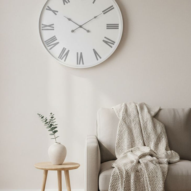 White round Flemings large wall clock by Hill Interiors showing a modern clock with black hands and minimalist design.