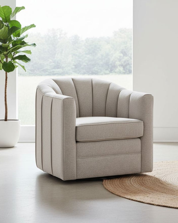 Beige Lily swivel linen arm chair with wooden legs, modern furniture piece by Hill Interiors.