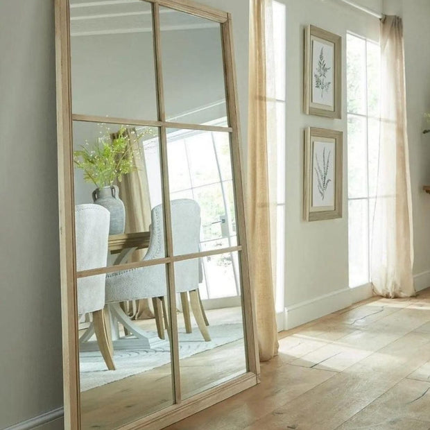 Extra large Hill Interiors Clarissa washed wood rectangle window-framed mirror, showcasing its rustic wooden frame and reflective surface.