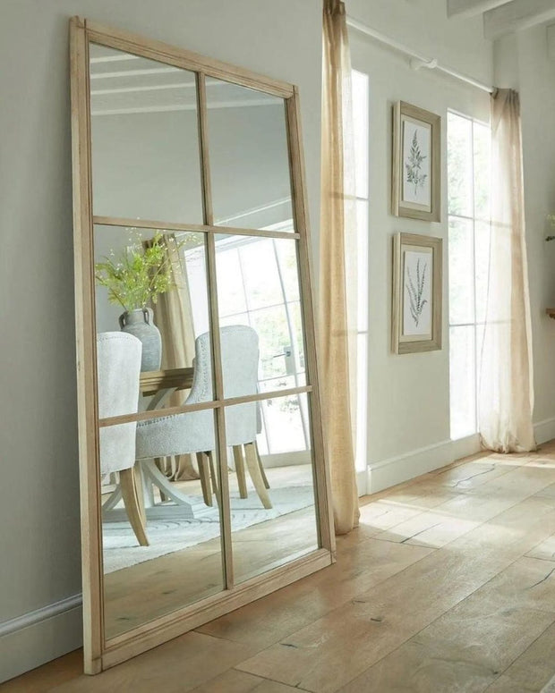 Extra large Hill Interiors Clarissa washed wood rectangle window-framed mirror, showcasing its rustic wooden frame and reflective surface.
