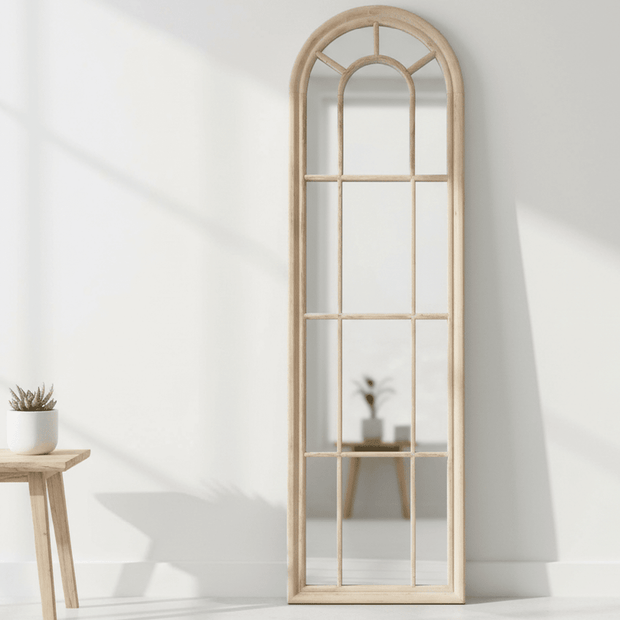 Cleo extra tall wood arched window framed mirror by Hill Interiors, featuring a tall, elegant mirror with a wooden arched window frame.