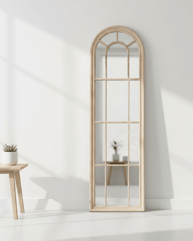 Cleo extra tall wood arched window framed mirror by Hill Interiors, featuring a tall, elegant mirror with a wooden arched window frame.