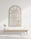 Hill Interiors Copgrove arched paned window mirror with vintage-style wooden frame, decorative glass panes, and elegant design.