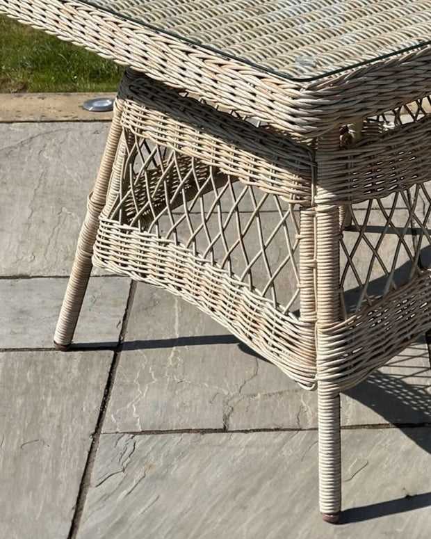 Outdoor 4-seater dining set from Hill Interiors' Rattan Provence Collection, featuring garden furniture with woven rattan design.