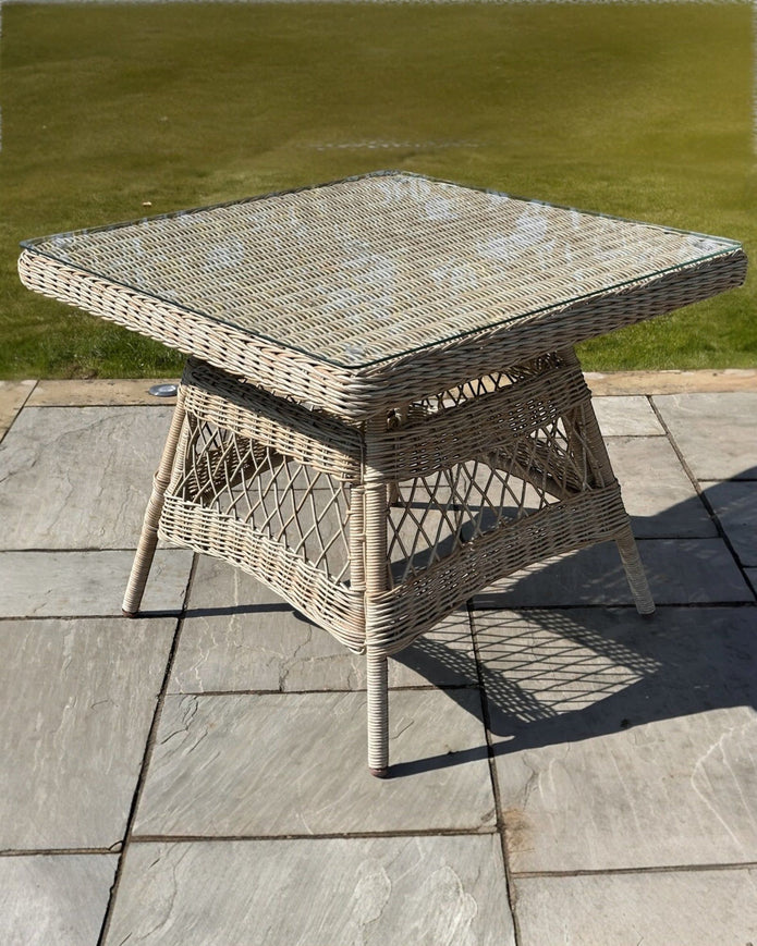 Outdoor rattan Provence Collection 4-seater dining set by Hill Interiors, featuring a garden furniture design with a table and chairs.