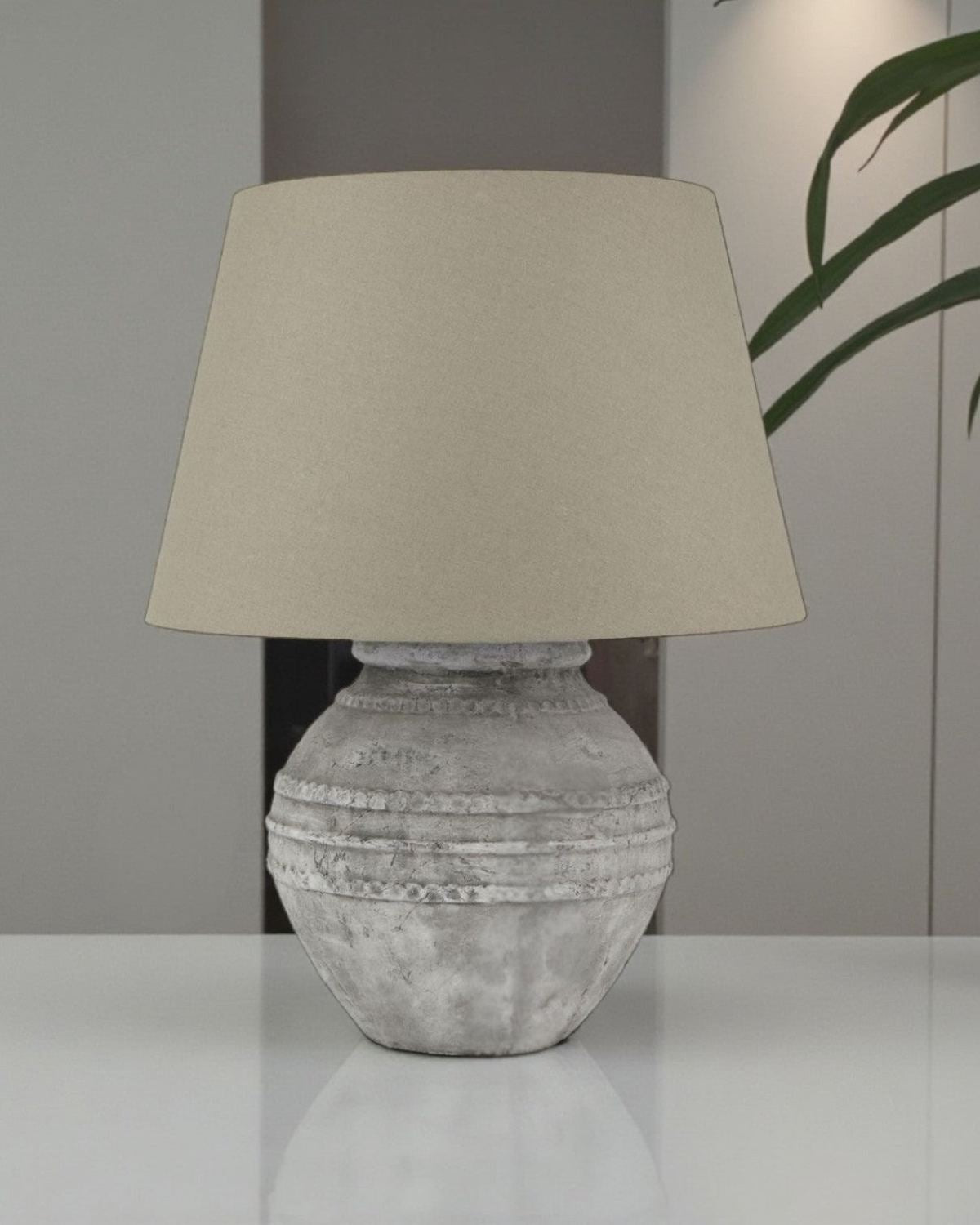 Athena Stone Regola Lamp by Hill Interiors, Mediterranean artisan home decor with textured stone finish and elegant design.