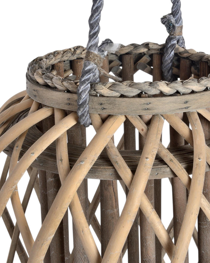 Tall natural rattan wicker garden candle lantern for home decor, featuring a rustic design and open top for candles.