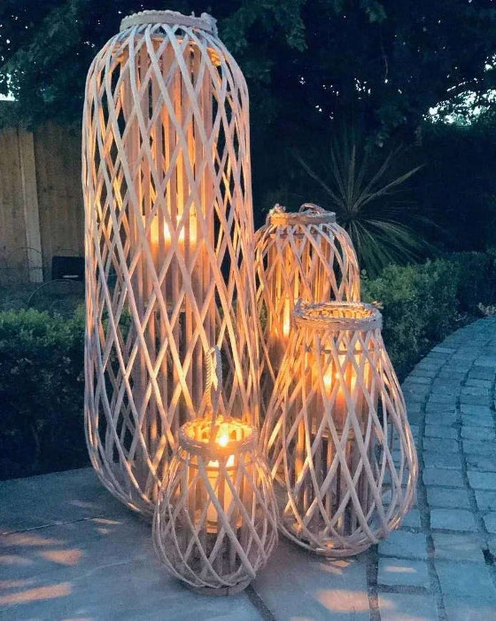 Tall natural rattan wicker garden candle lantern for home decor, featuring a sleek design and open sides for candle placement.