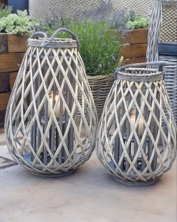 Natural rattan wicker bulbous garden candle lantern for outdoor home decor, by Hill Interiors.