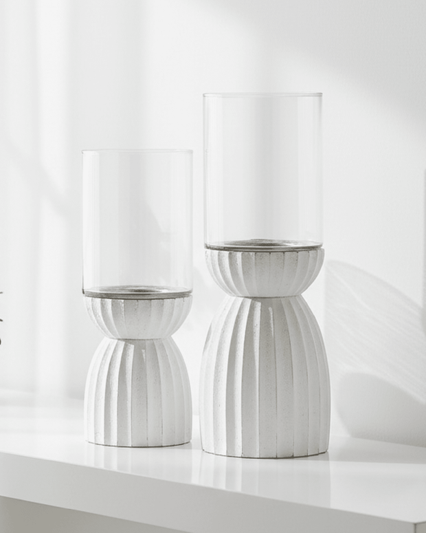 White carved hurricane lantern for home decor, featuring intricate design and sturdy glass, ideal for stylish interior accents.