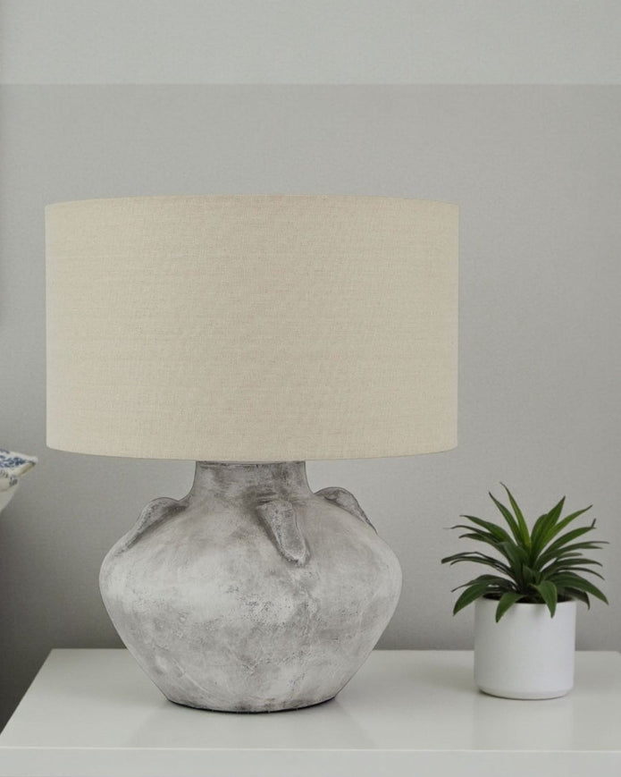 Athena handcrafted stone lamp by Lekanis Design, 32cm tall, showcasing a textured stone base and warm lighting for elegant decor.